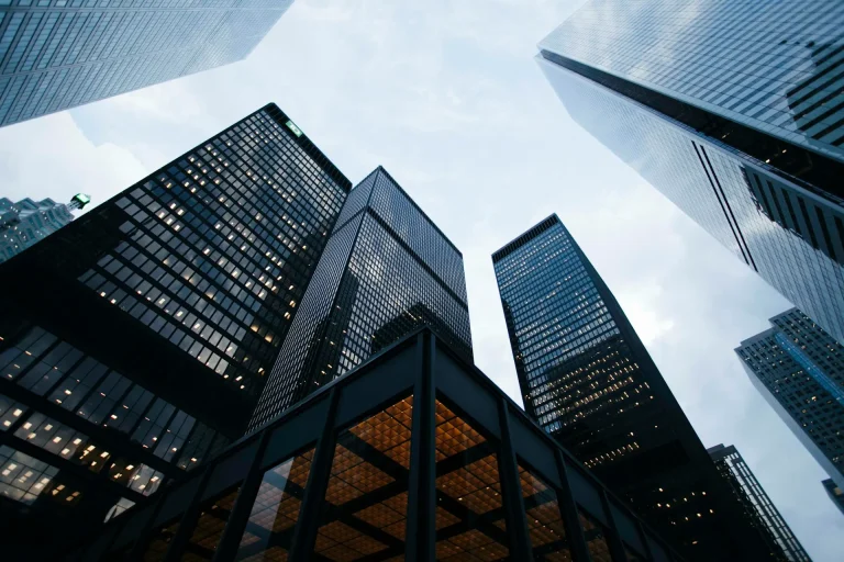 Modern glass office towers seen from below